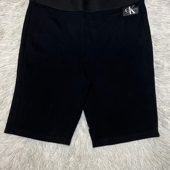 Calvin Klein Jeans| Women's black stretchy athletic biker shorts - Picture 9 of 11